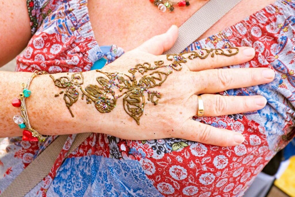 Hand painting with henna on the market in Marrakech Morocco